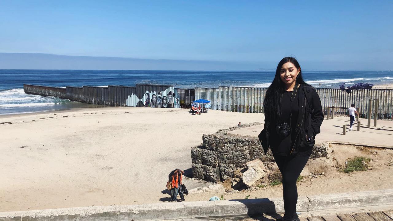 Lizbeth De La Cruz Santana with the completed mural Lizbeth De La Cruz Santana with the completed mural