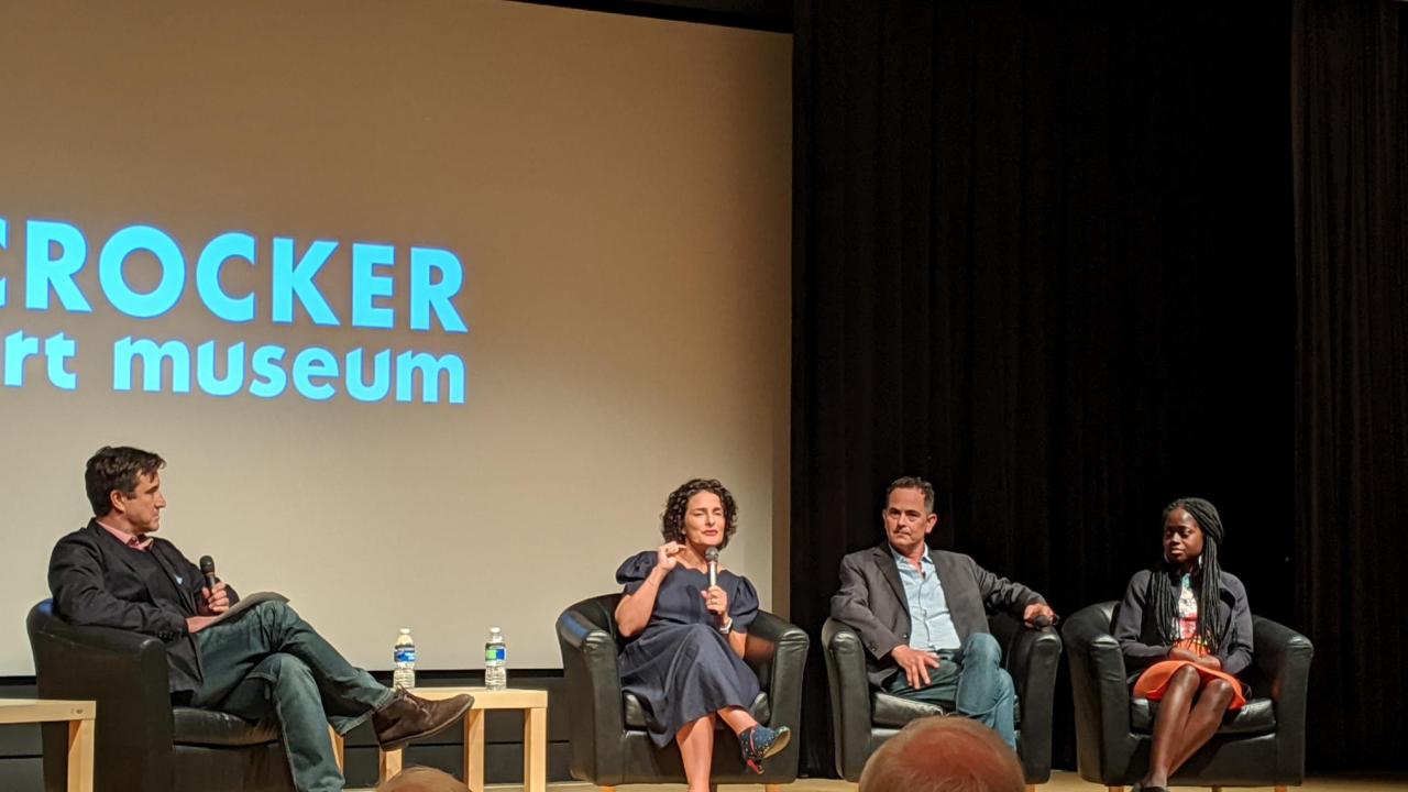 Filmmakers and panelists seated onstage in front of Crocker Art Museum logo