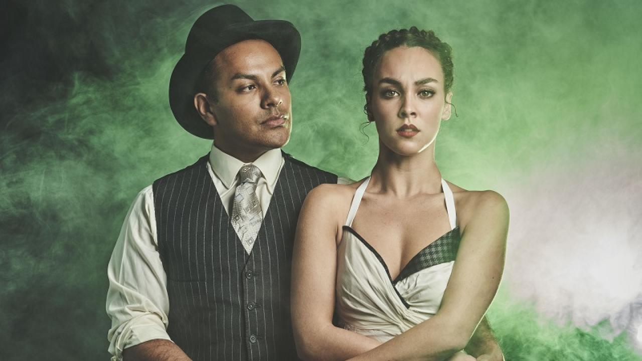 Threepenny Opera actors against green smoky background