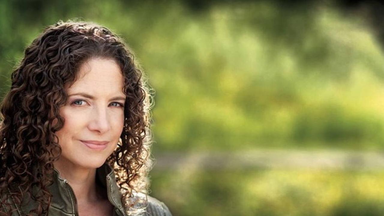 Karima Bennoune against a green background