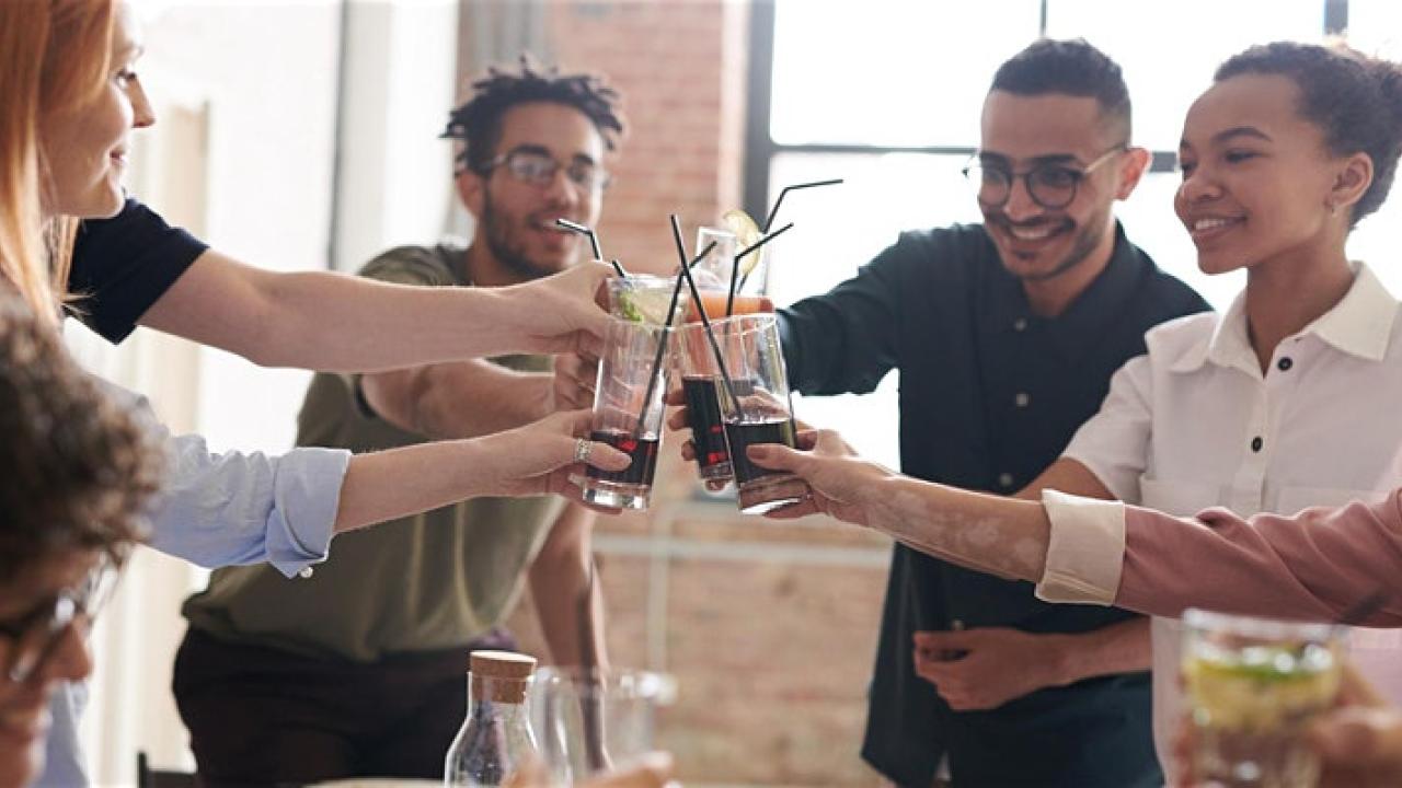 Group of people clinking glasses