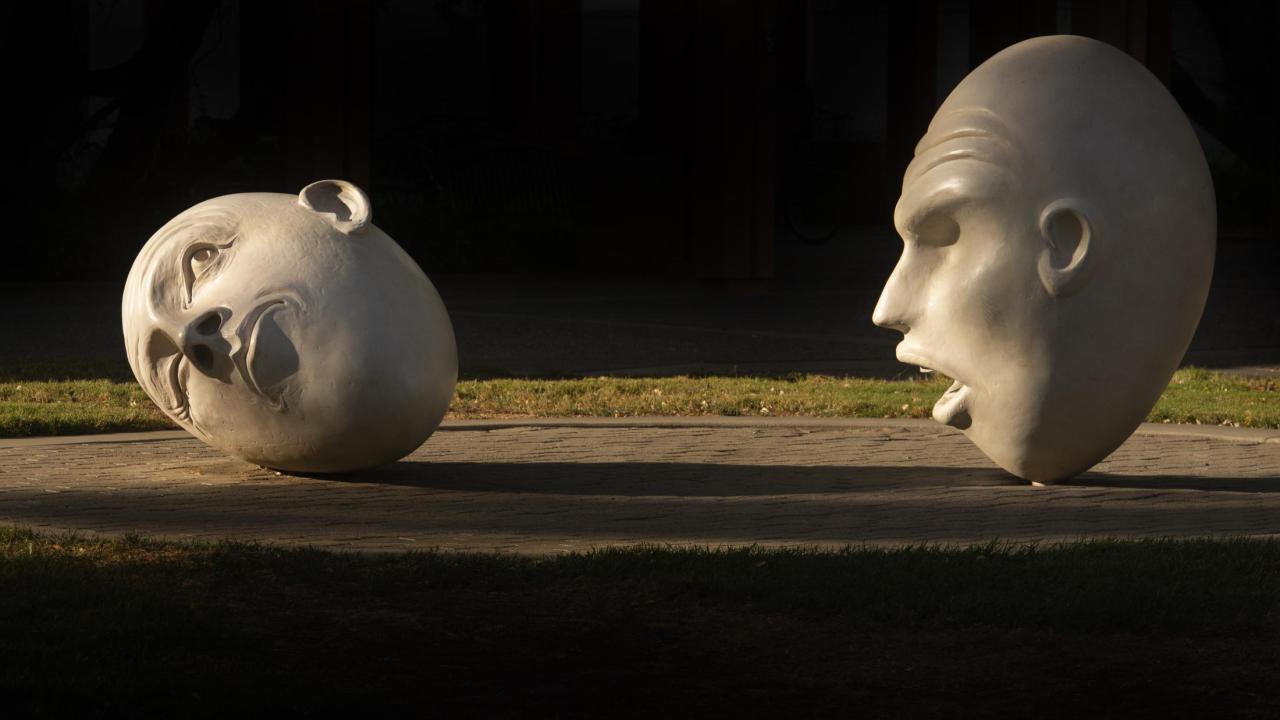 Yin and Yang Egghead sculpture by Robert Arneson in front of the Main Theatre.