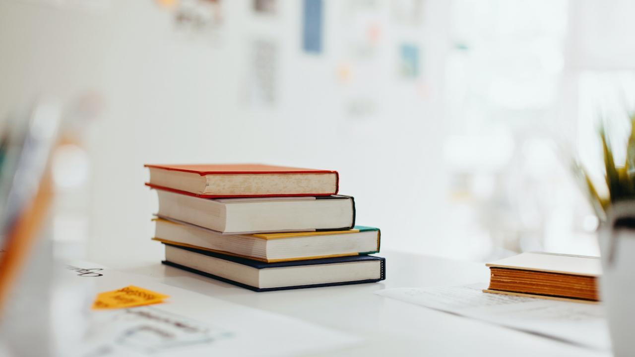 stack of books on a white table