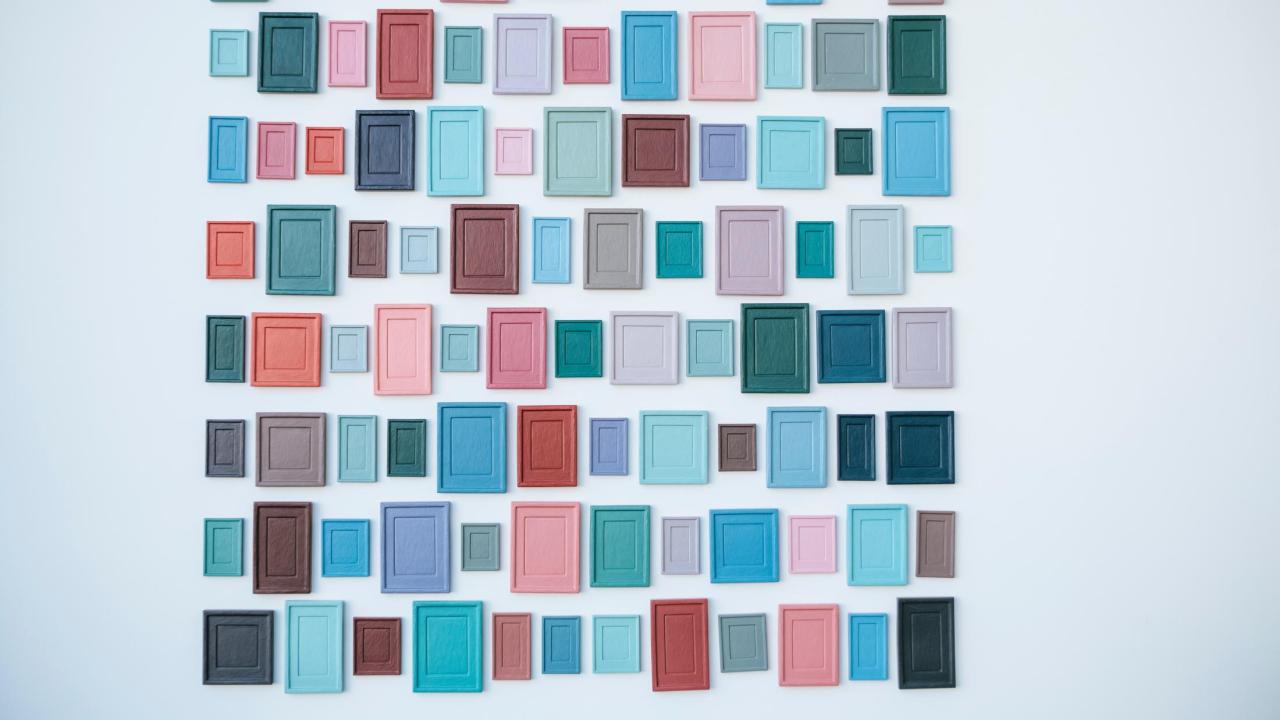 photo of gallery exhibition of many painted wooden squares